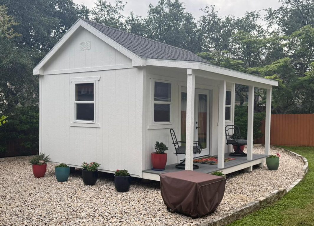 White Alamo Series shed with an A-frame roof and front porch