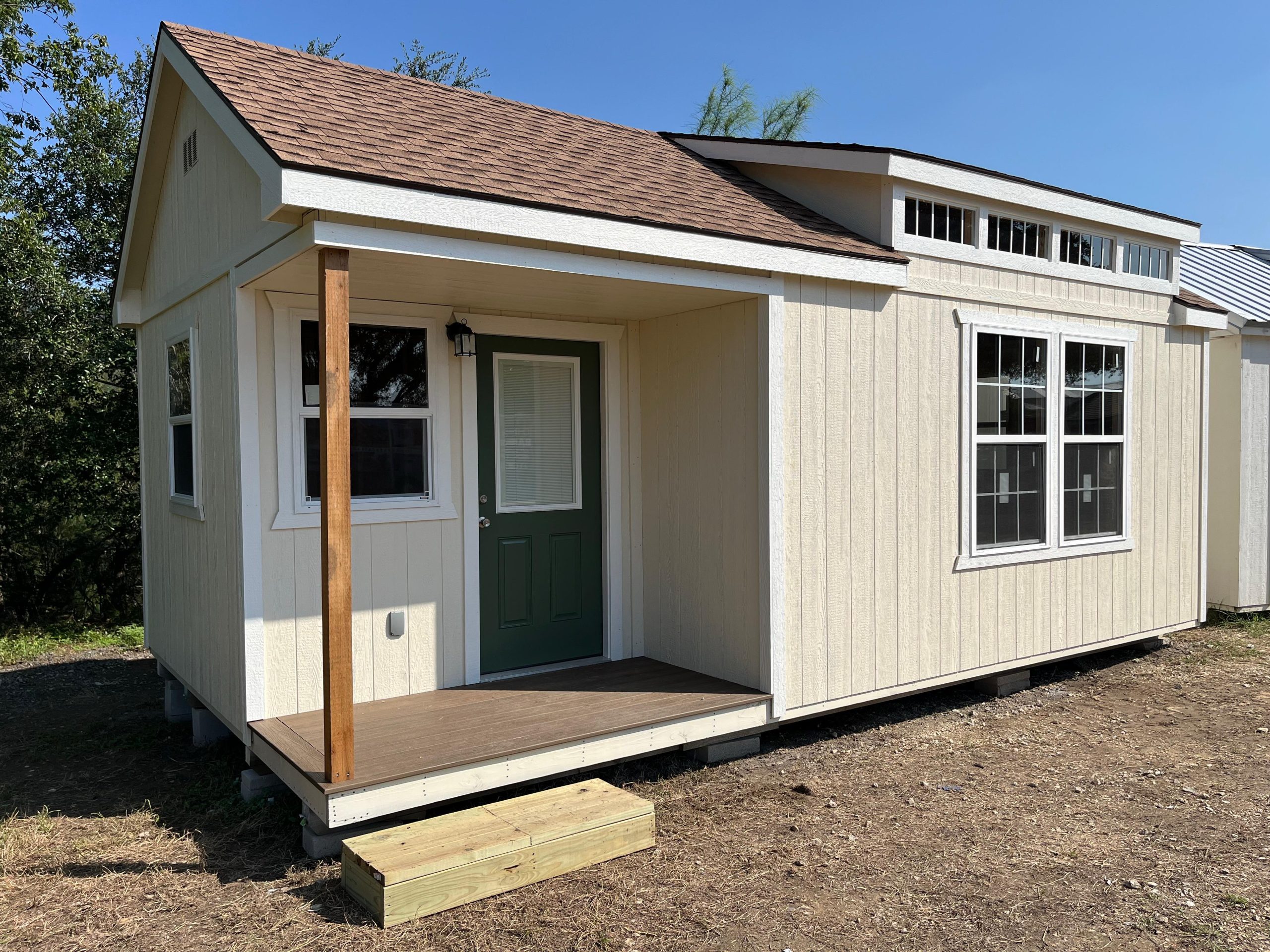 Alamo Series exterior with a front porch and dormer roof option